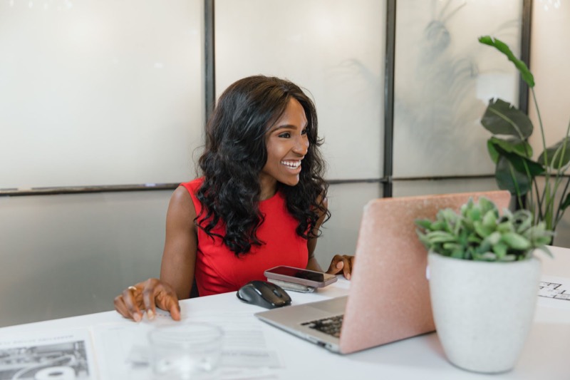 A small business owner reviewing referral performance on a laptop